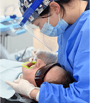Patient receiving monitored dental care under general anesthesia