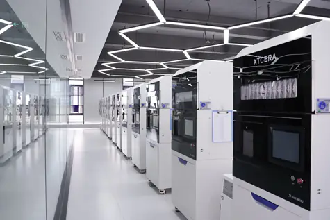 A high-precision milling machine shaping zirconia blocks into custom dental crowns as part o